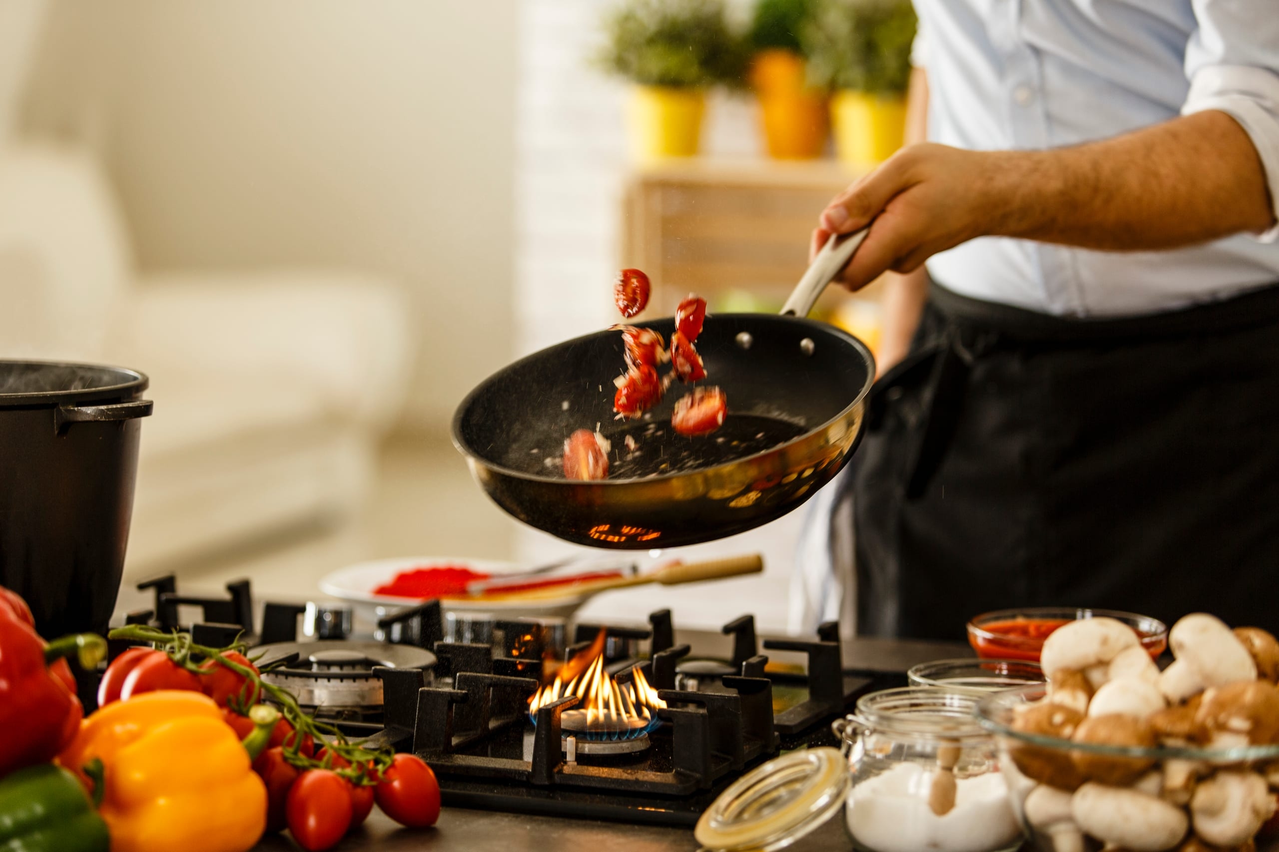 Chef Tossing Vegetables From Cooking Pan The Wellington Agency